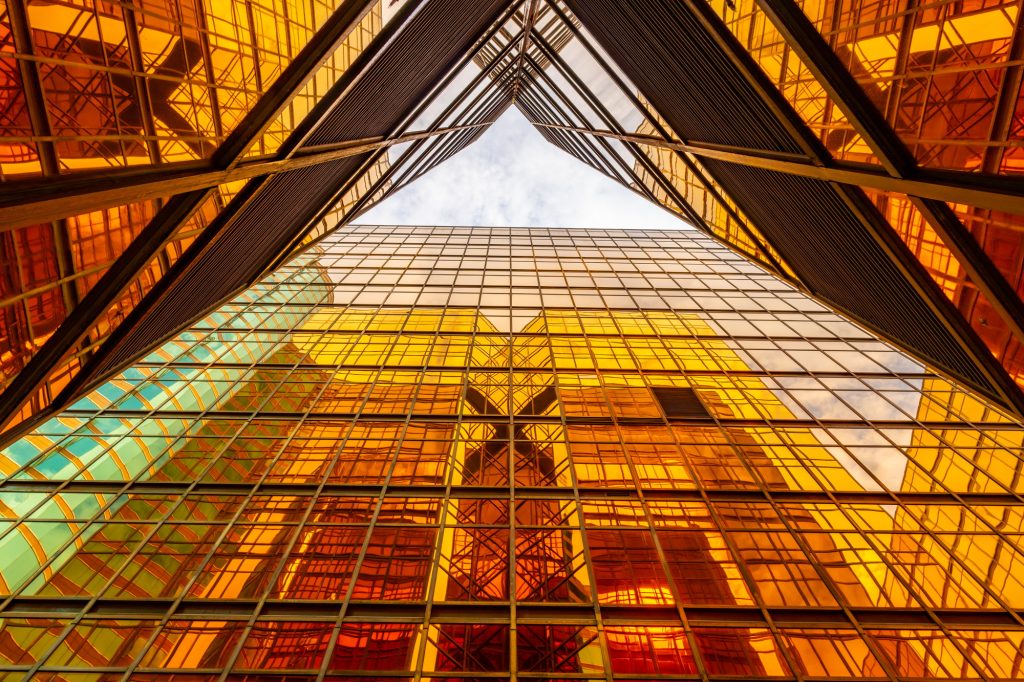 Golden tall buildings and glass reflections in Hong Kong Island